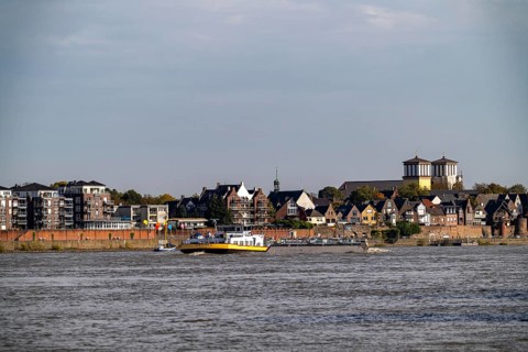 Cargo ships on the Rhine near Rees, Church of the Assumption of the Virgin Mary North