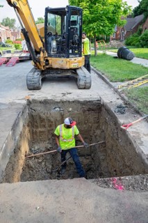Detroit, Michigan, Workers replace old lead water service lines with copper pipes. Lead is harmful