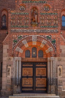 Odense, early Gothic St Albani Church, Roman Catholic church, entrance portal with wood carvings,