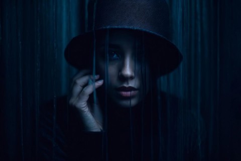 A depressed woman woman is staring with vacant look, AI generated