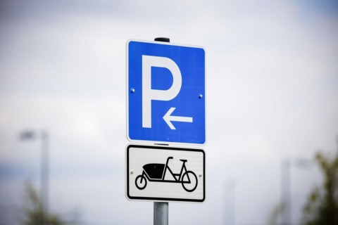 Symbolic photo. A sign for reserved parking spaces for cargo bikes on a newly built car park.