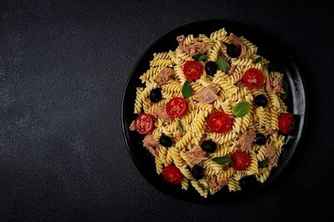 Tuna salad, fusilli pasta, olives and cherry, olive oil, homemade