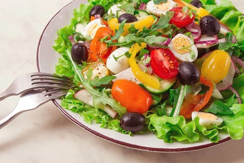 Vegetable salad, with quail eggs and olives, fresh, close-up, no people