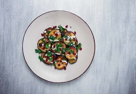 Fried eggplant, with white sauce, pomegranate seeds, top view, no people