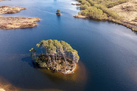 Aerial view of island Dumbledore's Grave, Harry Potter film location, lake Loch Eilt, scottisch