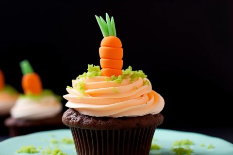 Easter cupcake with cream frosting and funny sugar carrot topping. KI generiert, generiert AI