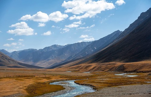 Burkhan valley with blue river, mountain landscape with golden meadows, Terskey Ala-Too, Tien Shan,
