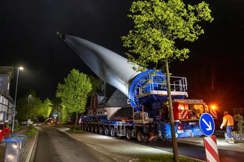 Transport of a 68 metre long, 22 tonne blade of a wind turbine, here in Breckerfeld-Waldbauer, with