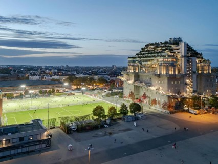 Aerial view of the Hamburg Bunker with green terraces and modern architecture in the evening