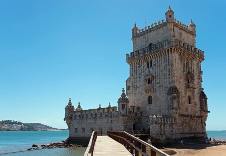 Medieval tower stands on a small promontory by the water, Torre de Belém, World Heritage Site,