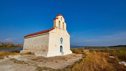 Agiou Petrou Chapel, Chapel of St Peter, Small church stands isolated under a clear blue sky next