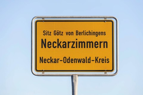 Town sign of Neckarzimmern in the Neckar-Odenwald district. The municipality has had an addition on