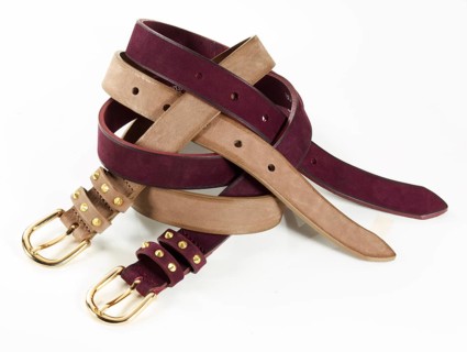 Leather belt in front of a white background, studio shot