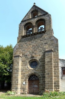 Saint-Pierre church and its distinctive comb bell tower in Arlet, Haute-Loire,