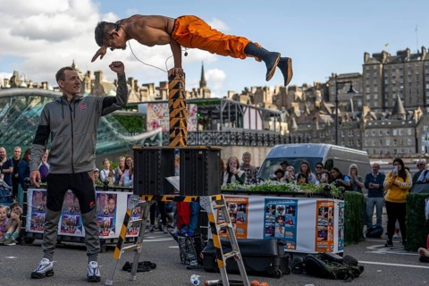 Street performers and spectators, acrobatic performance, Prince Street, world's largest cultural