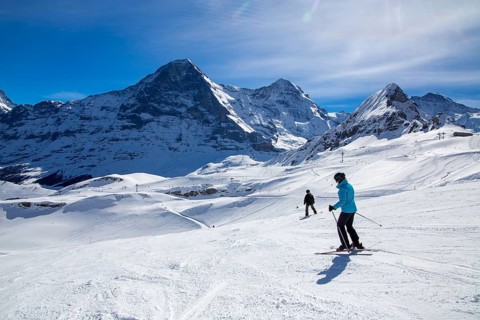 Skiing against the backdrop of the north face of the Eiger in Grindelwald, Switzerland, Europe