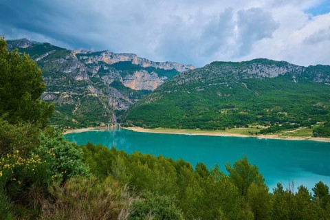 Mountain landscape with the Lac de Sainte-Croix reservoir and tree-covered slopes, summer, Lac de