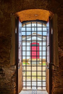 Small church seen from inside an old prison in the historic city of Mariana in the state of Minas