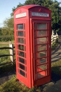 Traditional red telephone box in the countryside, Sussex, England, United Kingdom, Europe