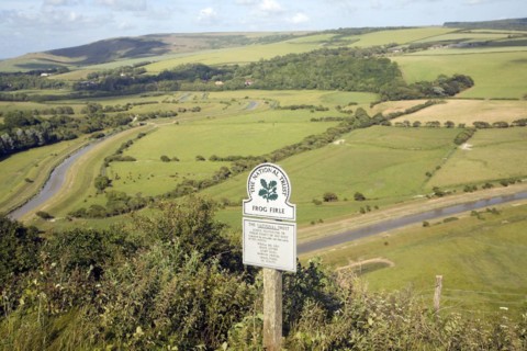 Shallow depth of field Frog Firle National Trust sign, High and Over, near Alfriston, east Sussex,