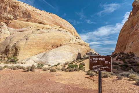 Sign leads hikers through the White Domes Loop trail in Valley of Fire State Park near Overton,
