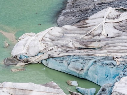 Rhone glacier covered with sheets to protect the ice from melting above the glacier cave,
