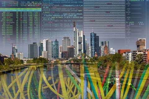 Symbolic image of critical infrastructure, skyline of Frankfurt am Main, data cable, hacker code