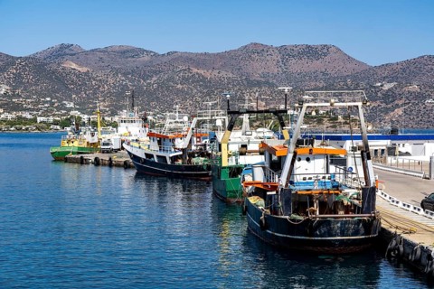 The village of Agios Nikolaos, in the eastern part of Crete, fishing boats in the harbour, Greece,