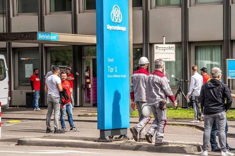 Steelworkers at a demonstration in front of the headquarters of ThyssenKrupp Steel Europe in