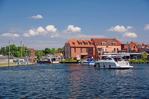 Europe, Germany, Mecklenburg-Western Pomerania, island town of Malchow, Lake Malchow, at the swing