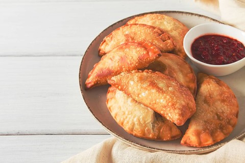 Fried chebureks, close-up, on a light background, no people