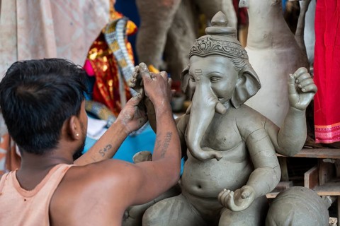 Artisan work on idols of the elephant-headed Hindu deity Ganesha at a workshop ahead of the Ganesh