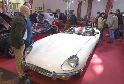 Visitors to Techno Classica take a look at a Jaguar E Type. Techno Classica is the trade fair for