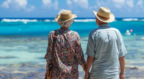 Healthy and happy active senior couple enjoying retirement close to a beach property, AI generated