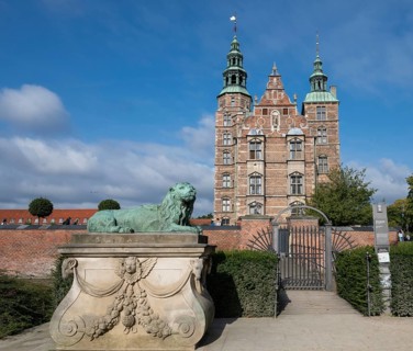 Bronze lion sculpture in front of Rosenborg Palace, 17th century royal palace and museum, Kongens