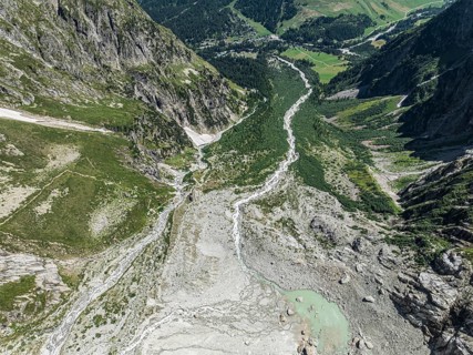 Aerial view, hiking path from La Fouly to Cabane de Neuve along a glacial streams, Valley Val