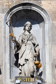 Historic City Hall Stadhuis on the Grote Markt, detailed view of the allegorical statue of Justice