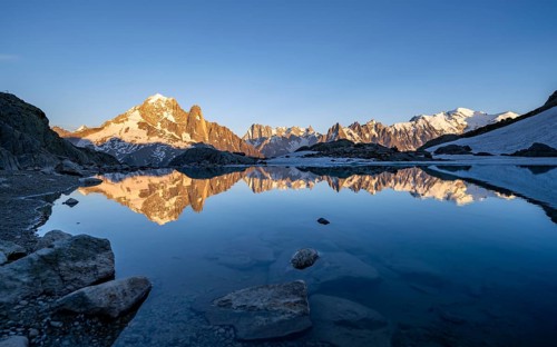 Evening mood, mountain landscape at sunset, alpenglow, water reflection in Lac Blanc, mountain
