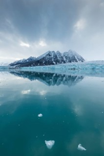 Mountains and glacier edge of Monacobreen, Liefdefjord, Woodfjord area, Spitsbergen Island,