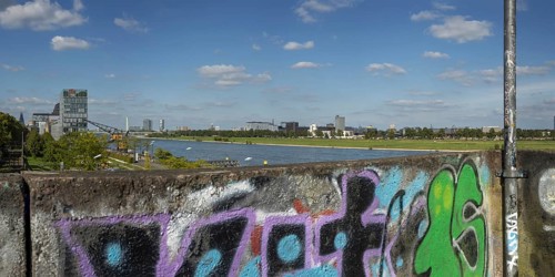 Panorama from the graffiti painted south bridge over the southern Rheinau harbour, the Rhine and