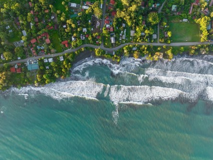 Top-down, aerial view, view of settlement and houses on the coast, Cahuita, Limón, Costa Rica,