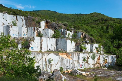 Abandoned quarry with white rock walls surrounded by trees, Kavala, Dímos Kaválas, Eastern