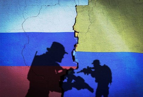 Russia vs Ukraine flag on cracked wall, concept of war between russia and ukraine, silhouette of