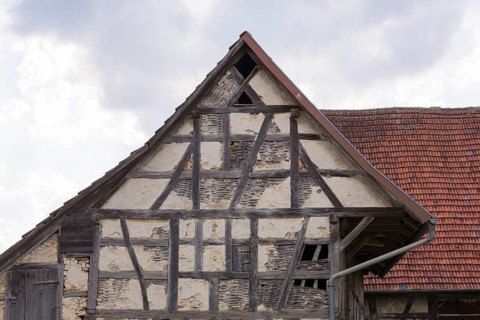 Old historic half-timbered house, gable, façade, in need of renovation, Swabian Alb,