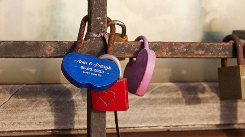 Personalised love locks, one in the shape of a heart, on a railing, harbour area, Rhodes Town,