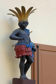 Sculpture Moor with arrow and headdress, Moor pharmacy, African, primitive people, detail, black,