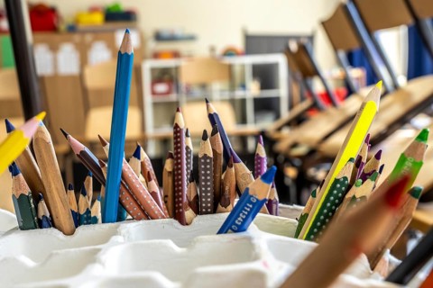 Classroom of a fourth grade, after school, the building is older but in good condition, coloured