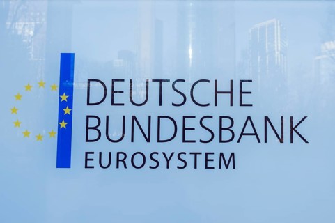 DEUTSCHE BUNDESBANK EUROSYSTEM logo on a glass surface featuring European stars and blue stripe,