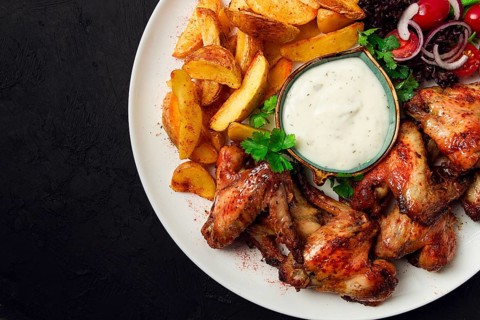 Fried chicken wings, with potatoes, and spices, homemade, fast food, no people