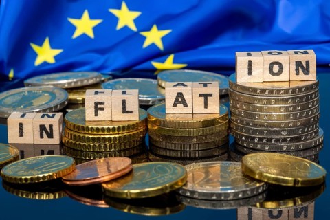 Symbolic image of inflation: euro coins and letters displaying the word INFLATION
